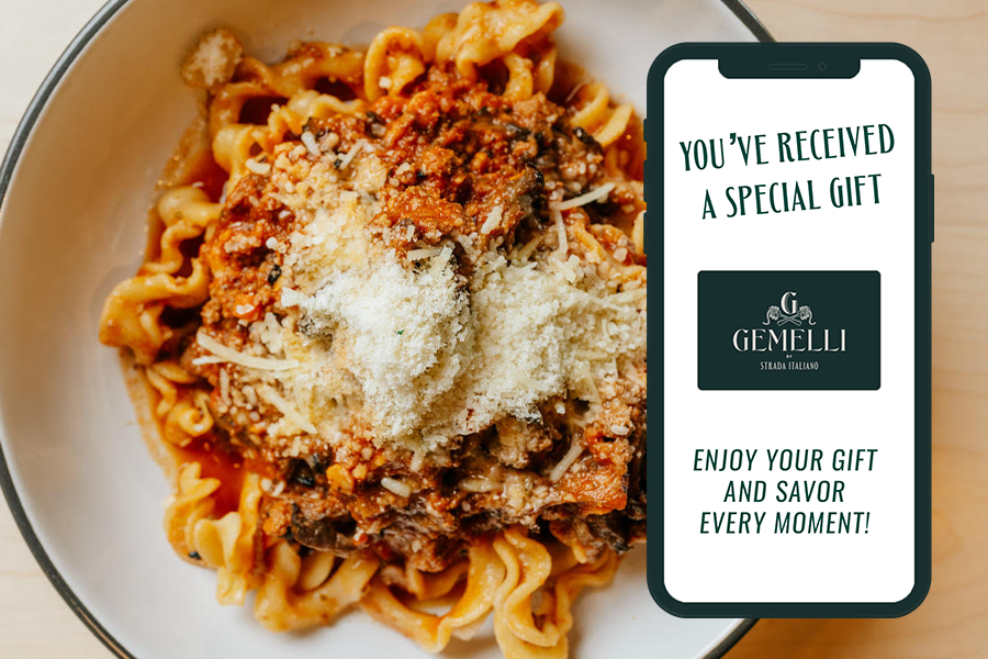 ragu dish with gemelli gift card on a phone in foreground